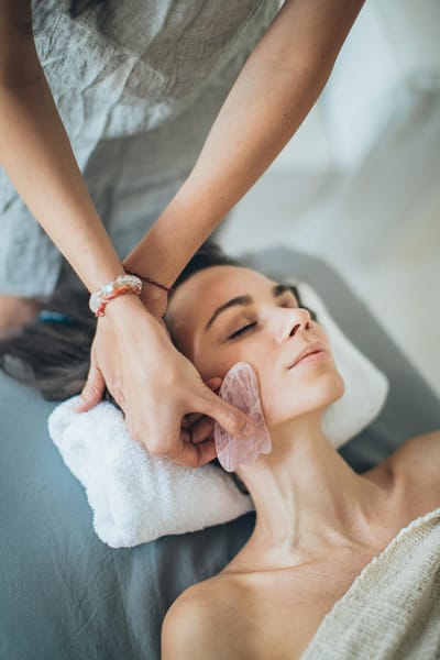 Woman receiving facial